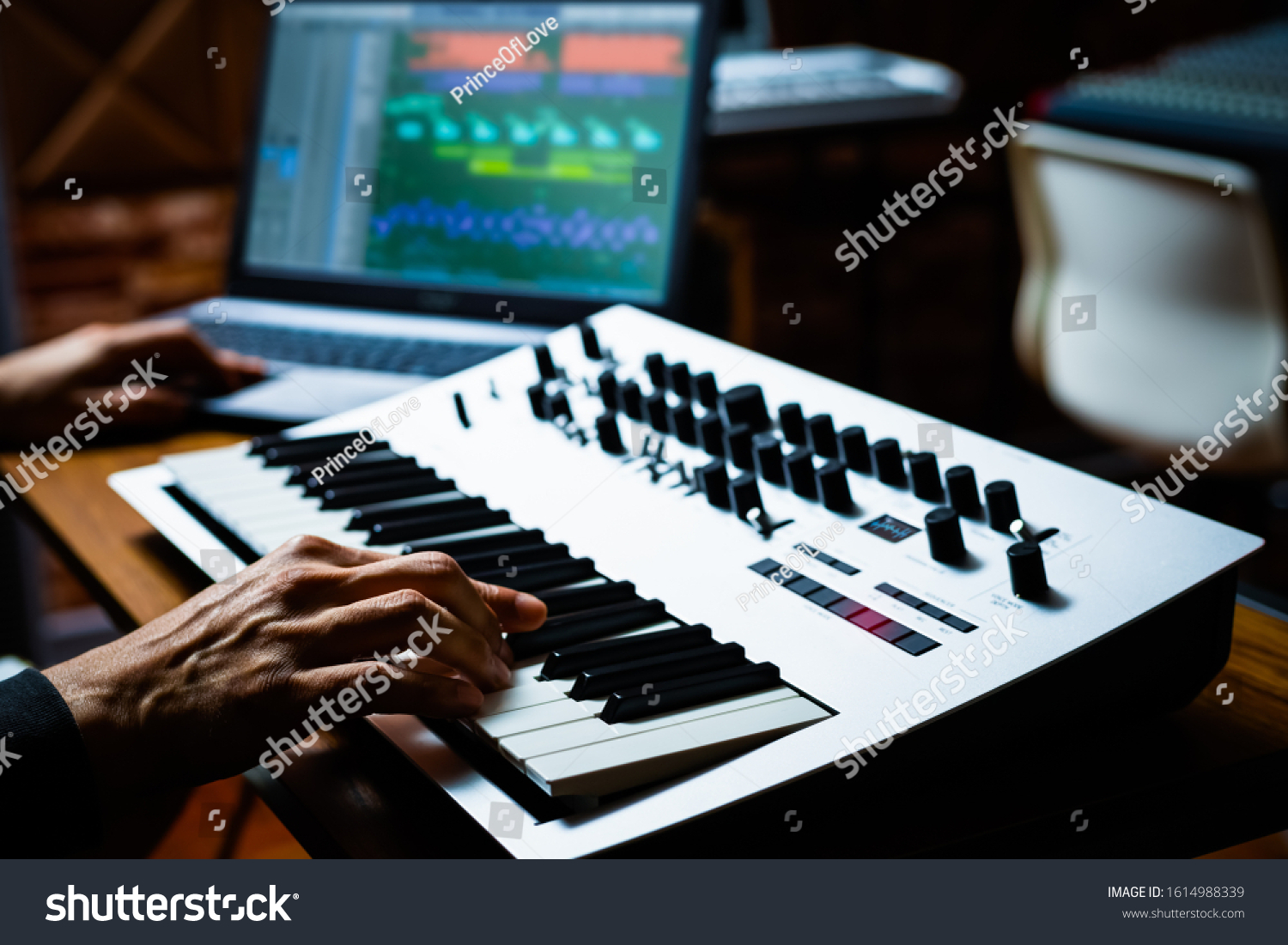 stock-photo-male-professional-musician-playing-keyboard-synthesizer-for-recording-midi-track-on-laptop-computer-1614988339